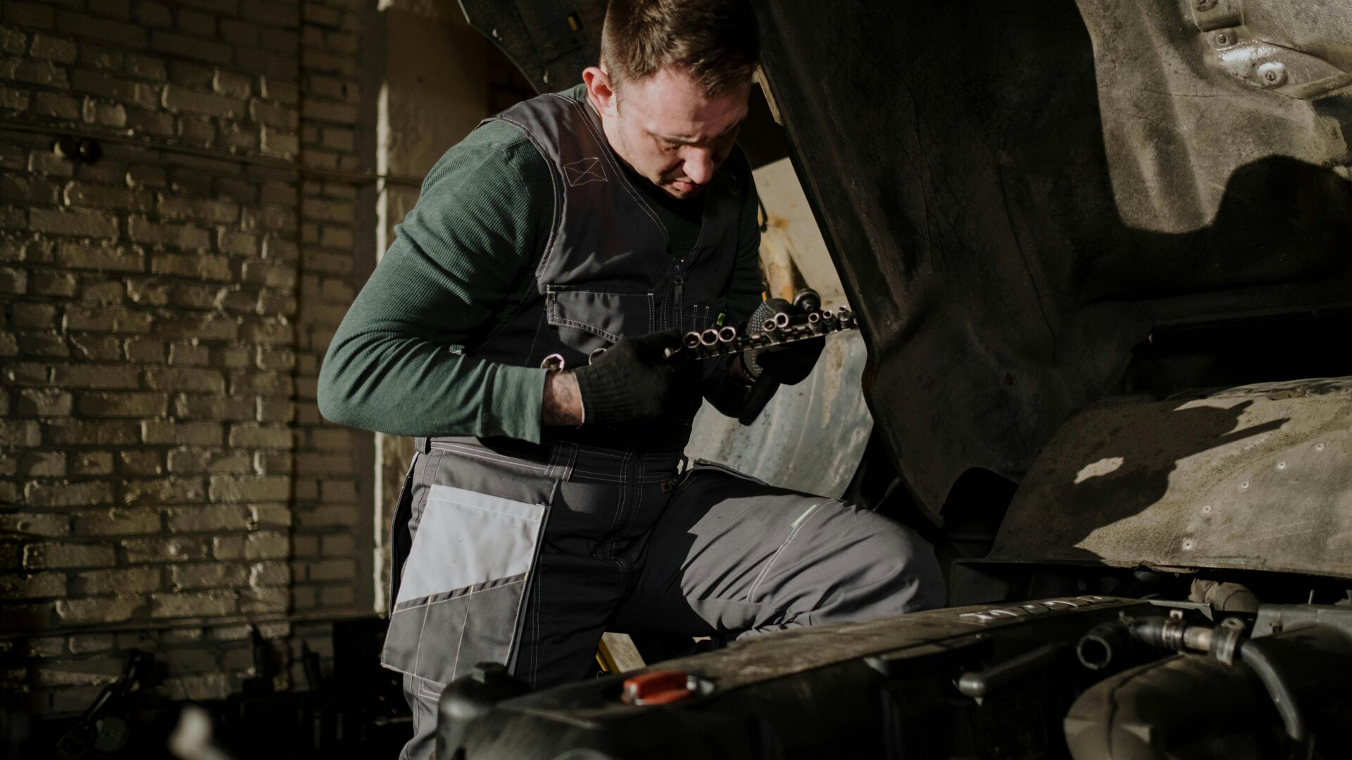 Small garage with a mechanic working on an order